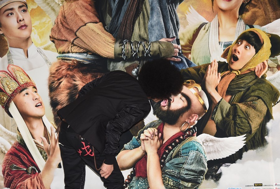 A passionate fan of 'Surprise' smooches the movie's poster—