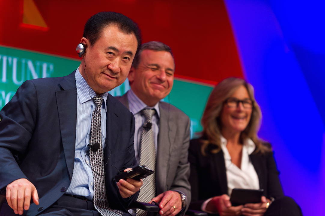 Dalian Wanda Group CEO Wang Jianlin (foreground) at the Fortune Global Forum 2013 with Disney CEO Bob Iger and then CEO of Burberry, Anglea Ahdrendts. (Creative Commons—Stephen Chow). 